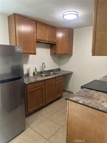 a bedroom with a bed and a night stand