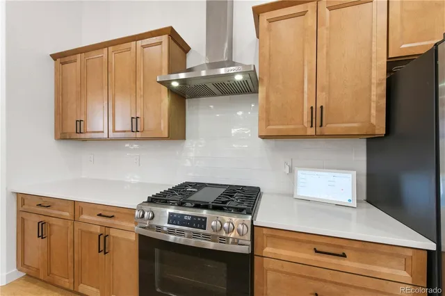 a kitchen with cabinets a sink and appliances