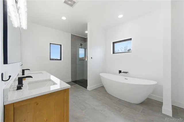 a bathroom with a bathtub and shower