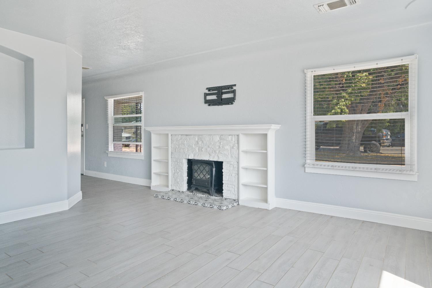 1900 Easy Street Hanford, CA 93230 - Photo 11 of 23 a view of a livingroom with a fireplace