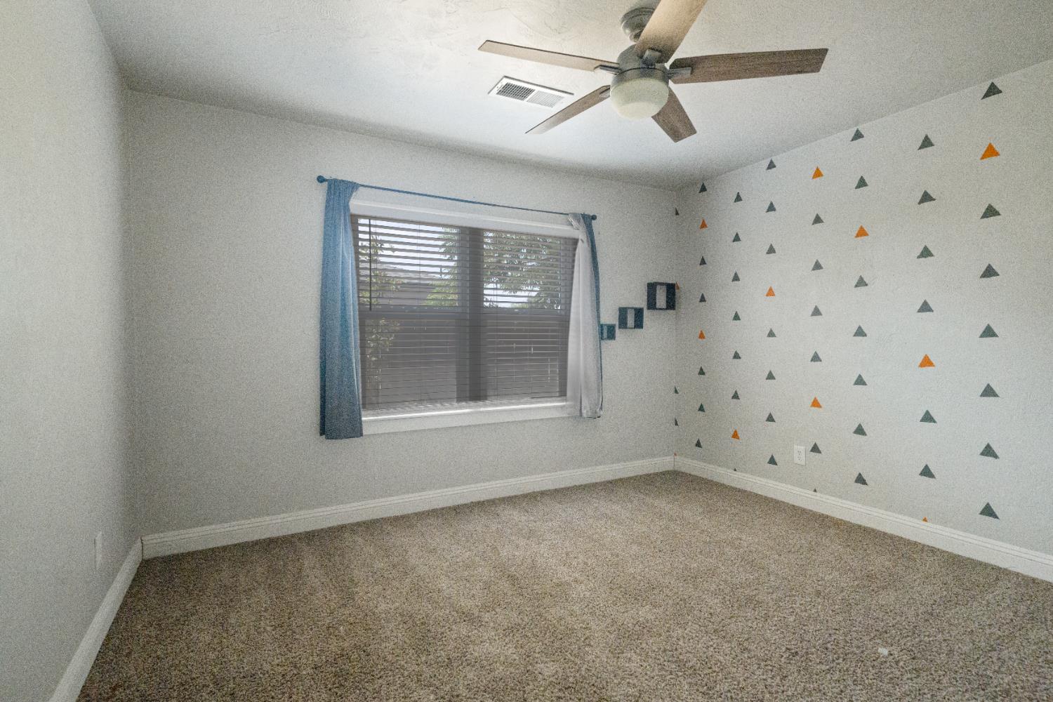 1900 Easy Street Hanford, CA 93230 - Photo 17 of 23 a view of an empty room with a window