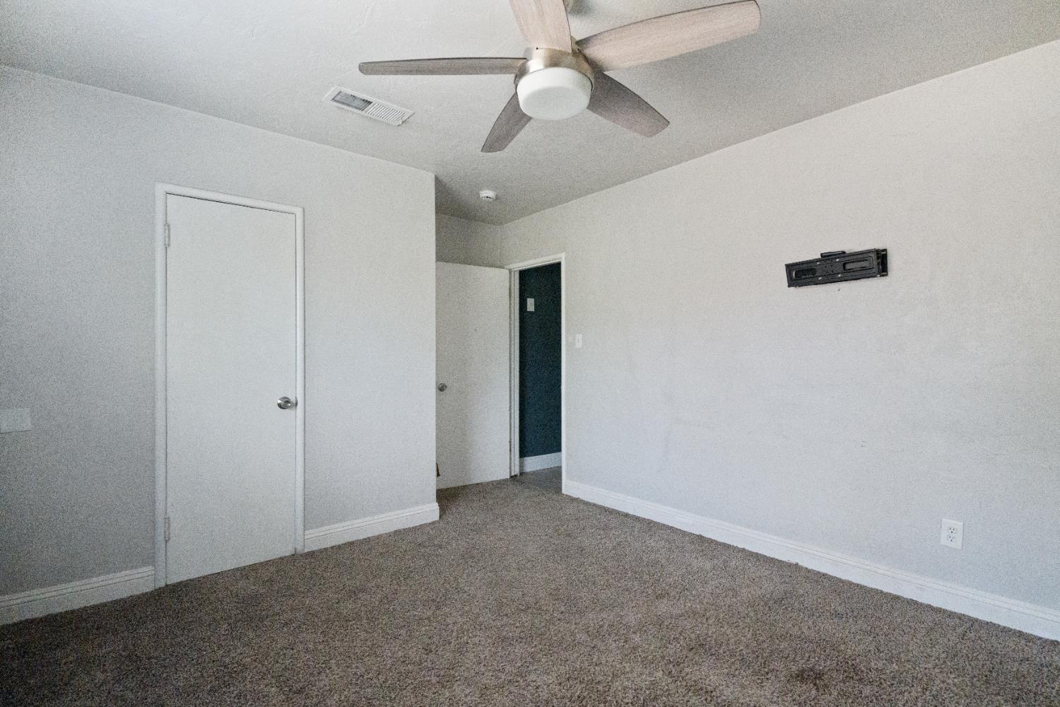 1900 Easy Street Hanford, CA 93230 - Photo 19 of 23 a view of an empty room with a ceiling fan