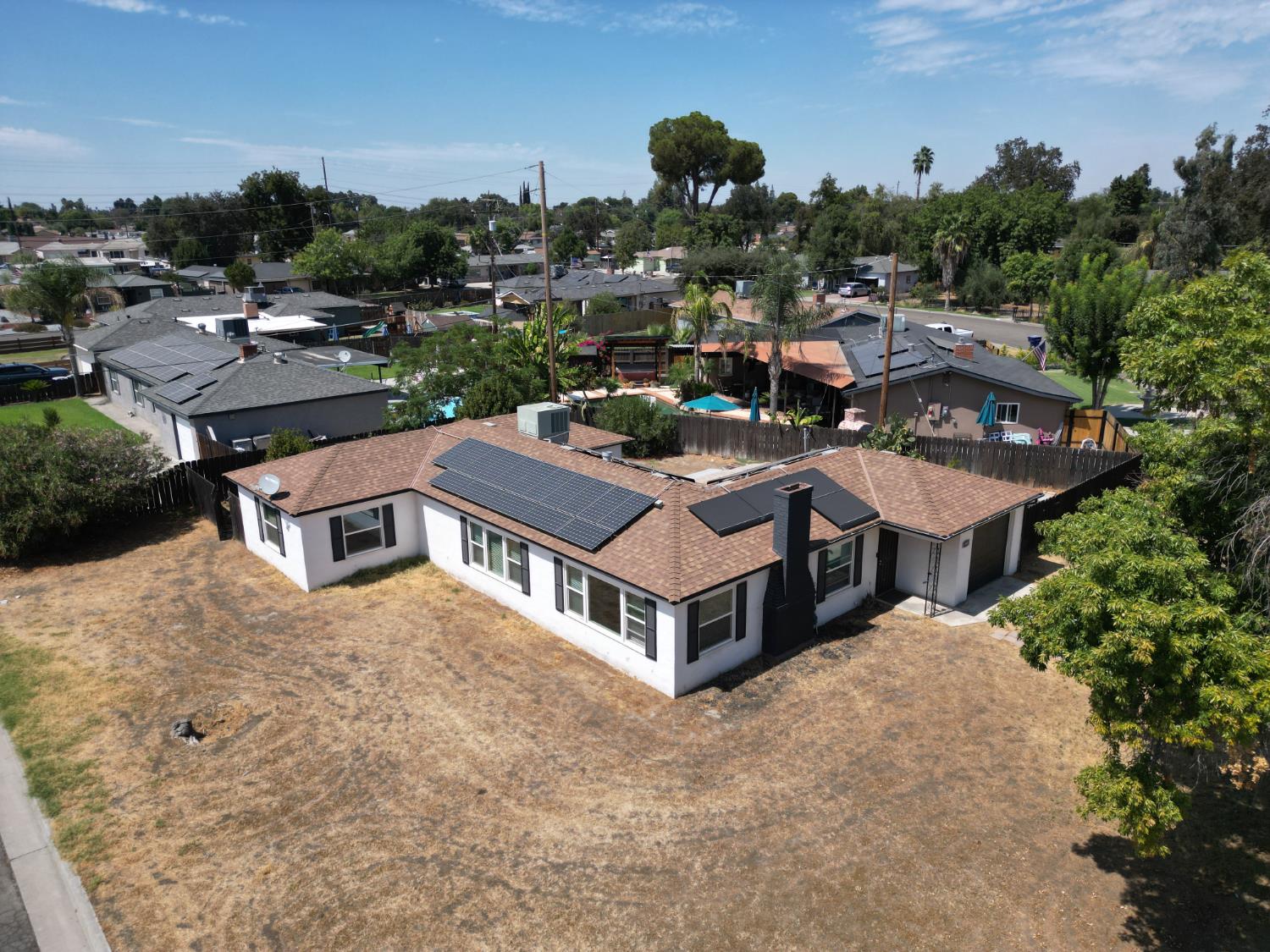 1900 Easy Street Hanford, CA 93230 - Photo 2 of 23 a aerial view of a house with a yard basket ball court and outdoor seating