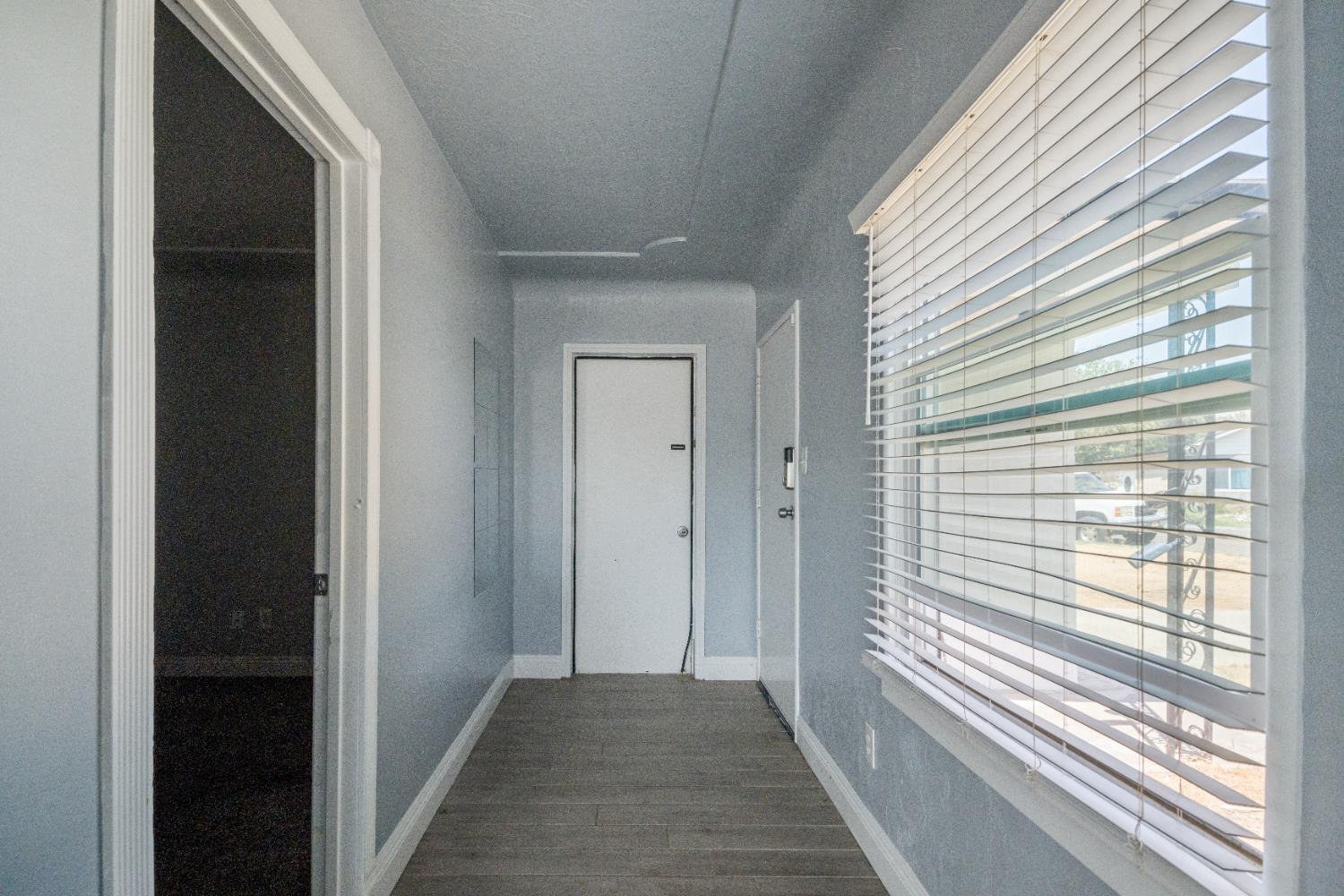 1900 Easy Street Hanford, CA 93230 - Photo 7 of 23 a view of a hallway with windows