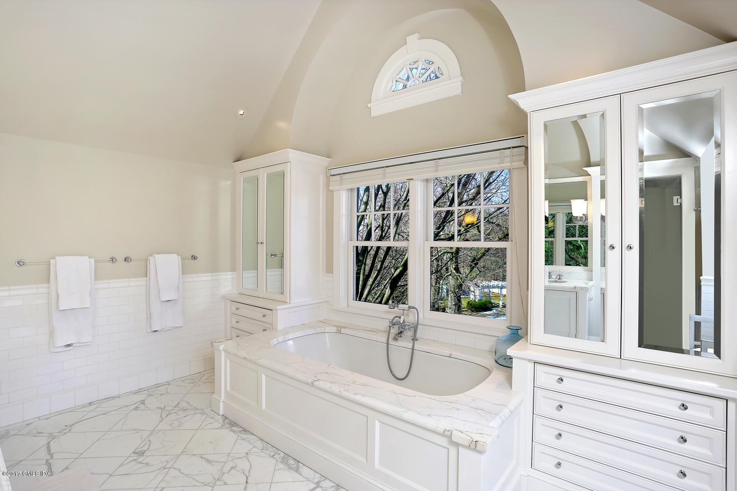 49 Calhoun Drive Greenwich, CT 06831 - Photo 13 of 21 a bathroom with a tub sink and mirror
