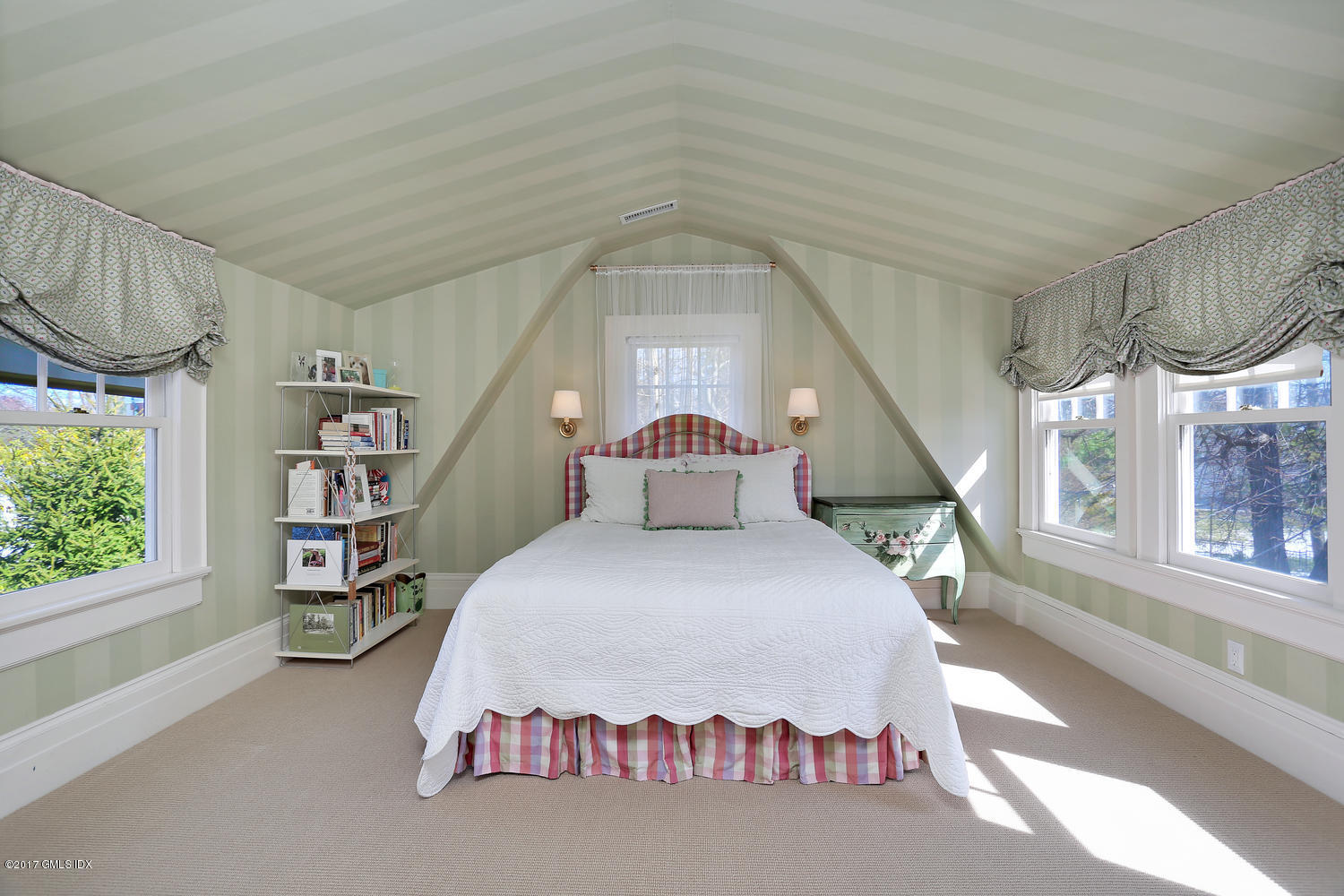 49 Calhoun Drive Greenwich, CT 06831 - Photo 17 of 21 a spacious bedroom with a bed and a large window