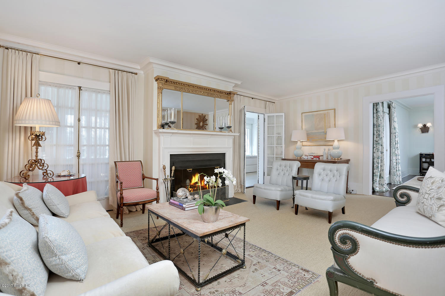 49 Calhoun Drive Greenwich, CT 06831 - Photo 3 of 21 a living room with furniture and a fireplace