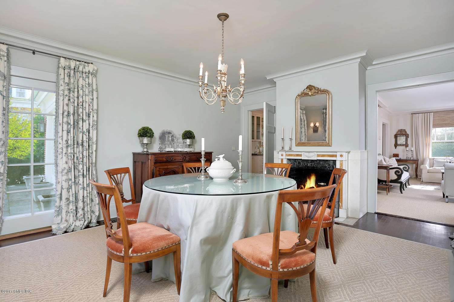 49 Calhoun Drive Greenwich, CT 06831 - Photo 4 of 21 a dining room with furniture a chandelier and window