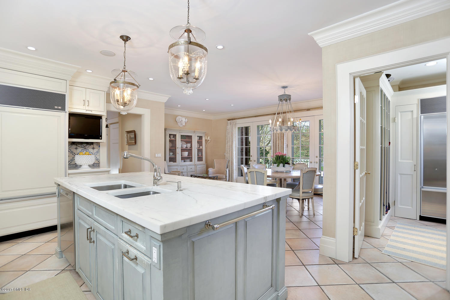 49 Calhoun Drive Greenwich, CT 06831 - Photo 6 of 21 a kitchen that has a lot of cabinets in it