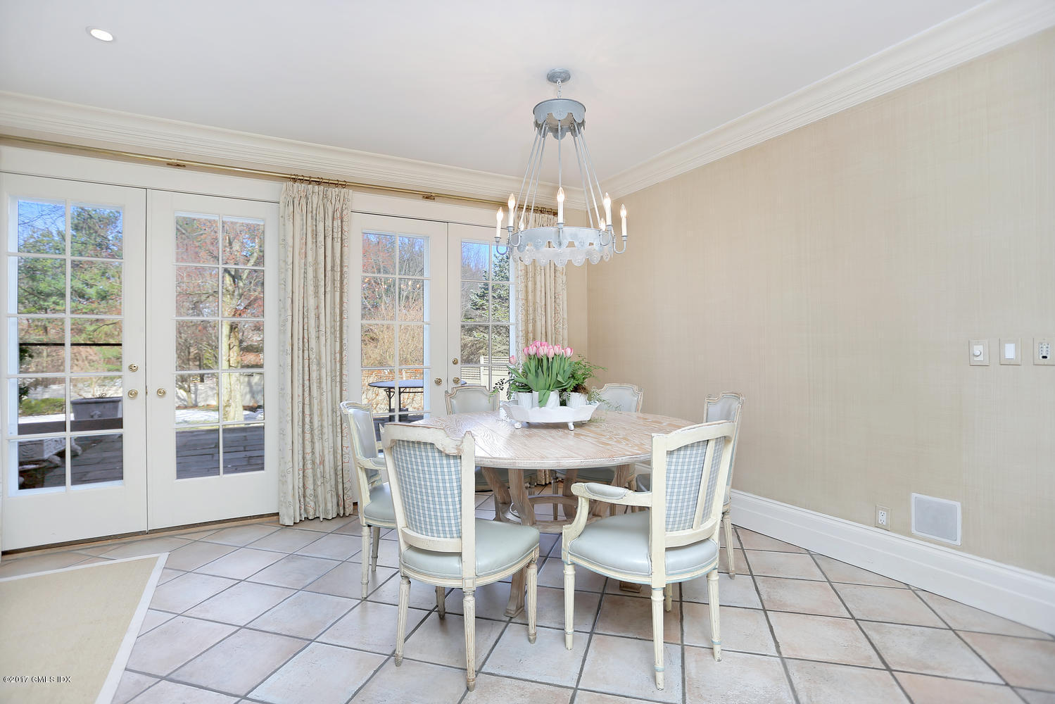 49 Calhoun Drive Greenwich, CT 06831 - Photo 7 of 21 a dining room with furniture a chandelier and window