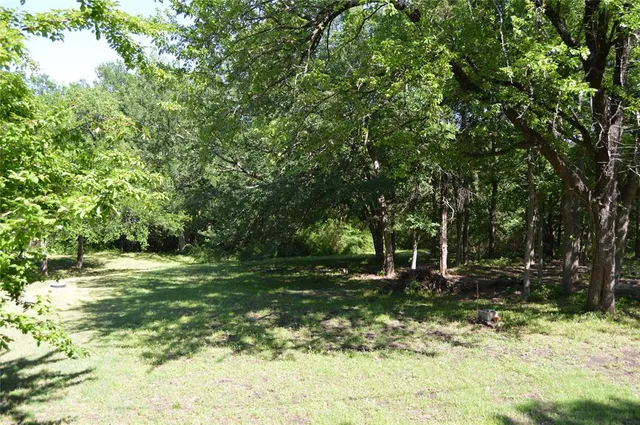 a fire hydrant in the middle of a field