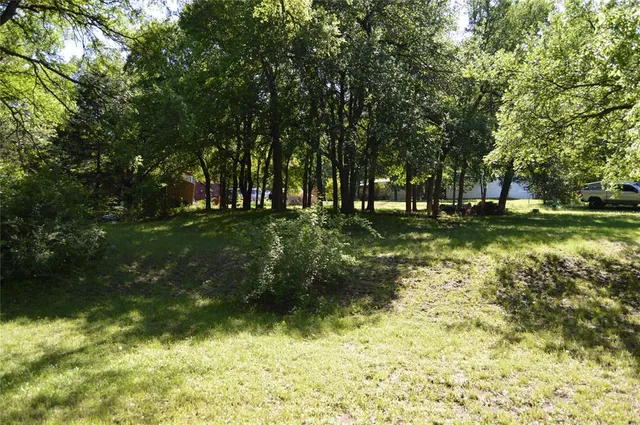 a backyard of a house with lots of green space