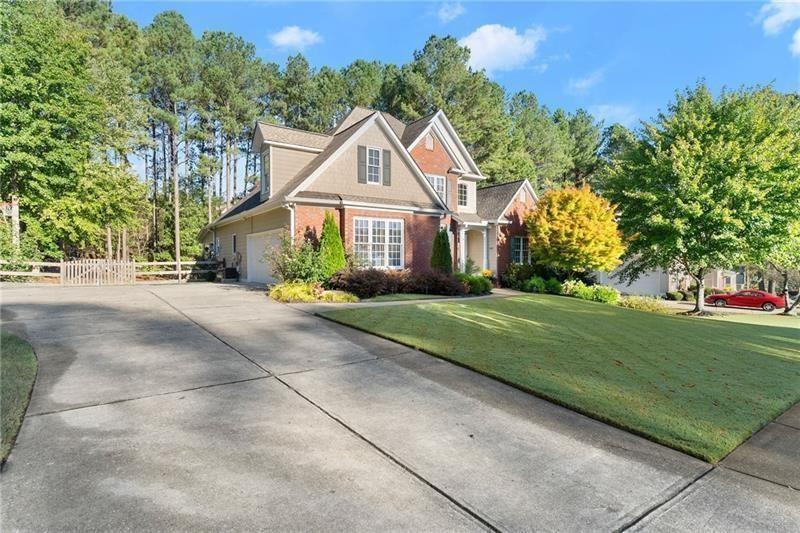385 Graves Road Acworth, GA 30101 - Photo 10 of 61 a front view of a house with a garden