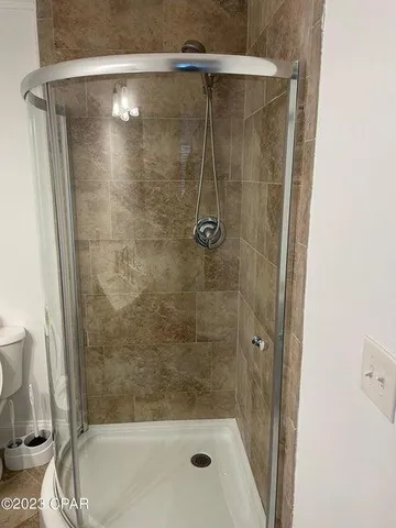 a view of a swimming pool with a lounge chair