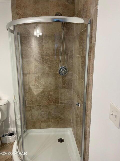 101 Cain Road, Unit B Panama City Beach, FL 32413 - Photo 8 of 13 a bathroom with a shower and bathtub