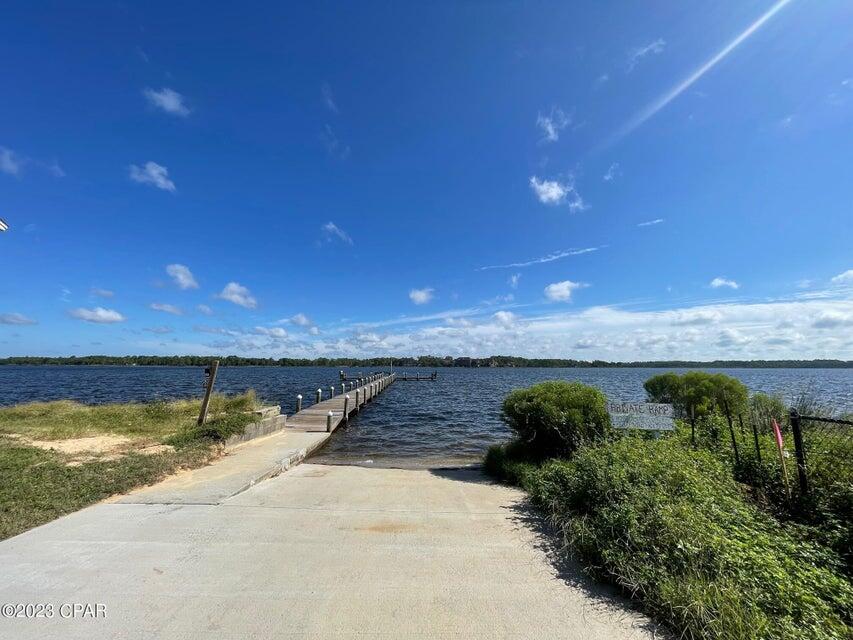 101 Cain Road, Unit B Panama City Beach, FL 32413 - Photo 10 of 13 a view of a swimming pool with an outdoor seating