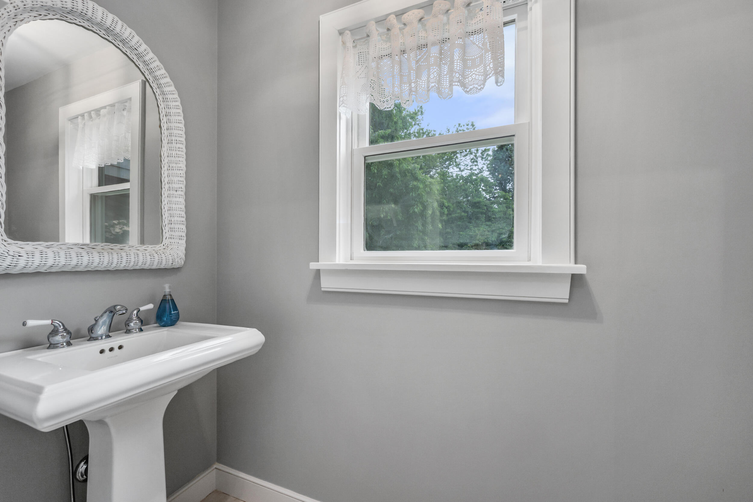 3528 Main Street Barnstable, MA 02630 - Photo 23 of 52 a bathroom with a sink and a mirror