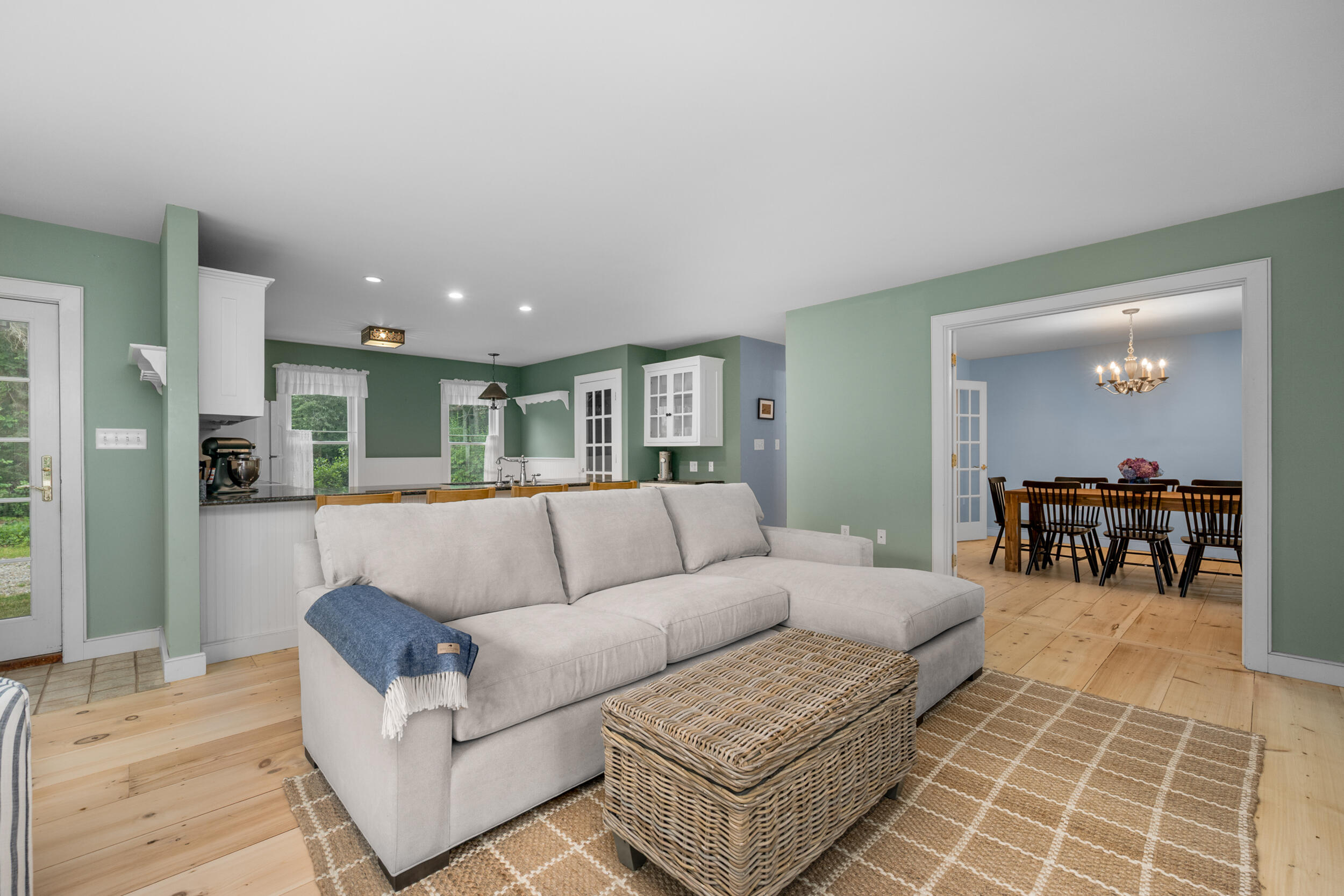 3528 Main Street Barnstable, MA 02630 - Photo 10 of 52 a living room with furniture and a dining table with kitchen view