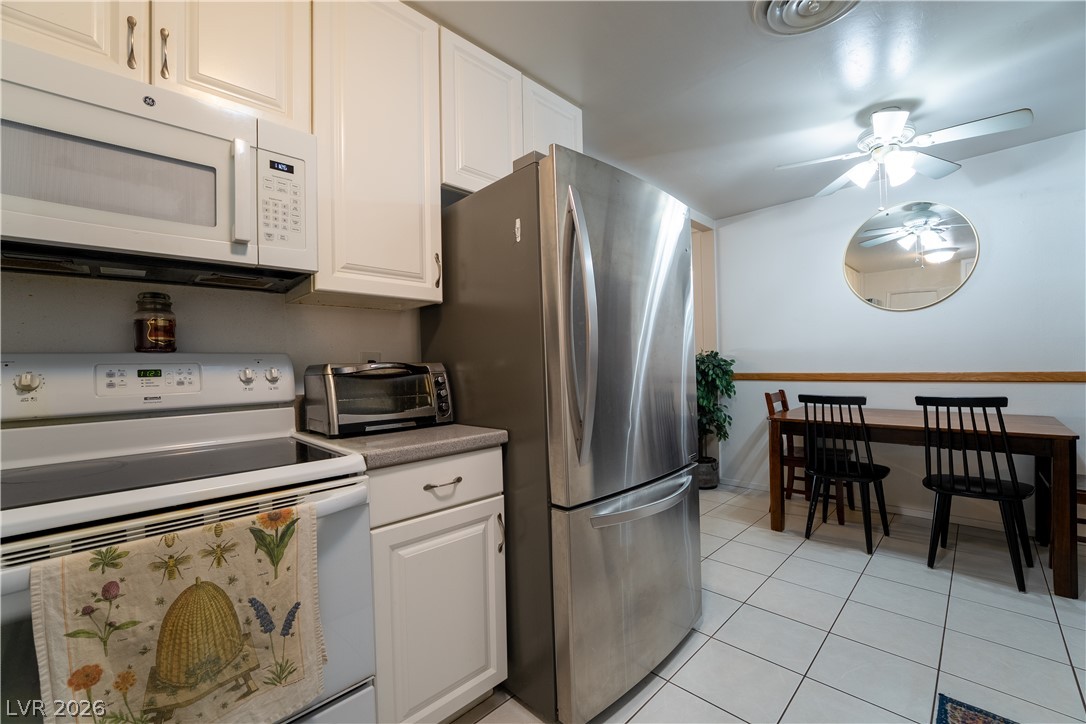 1324 Appaloosa Road Boulder City, NV 89005 - Photo 10 of 42 A streamlined kitchen layout features stainless steel appliances and crisp white cabinetry.