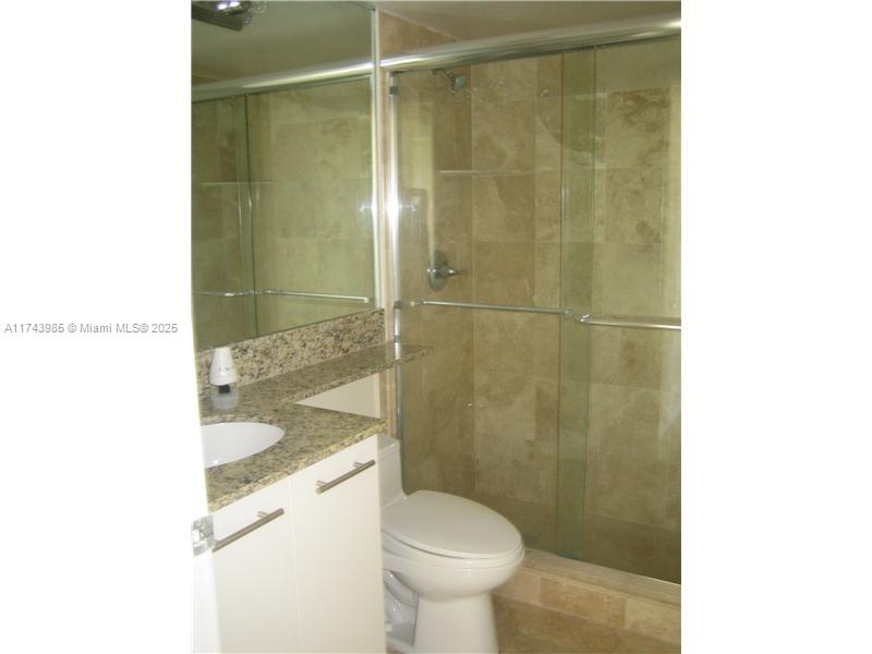3300 Northeast 191st Street, Unit 1708 Aventura, FL 33180 - Photo 3 of 7 a bathroom with a sink and a toilet