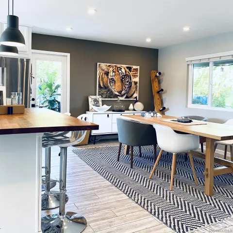 a view of a dining room with furniture window and wooden floor