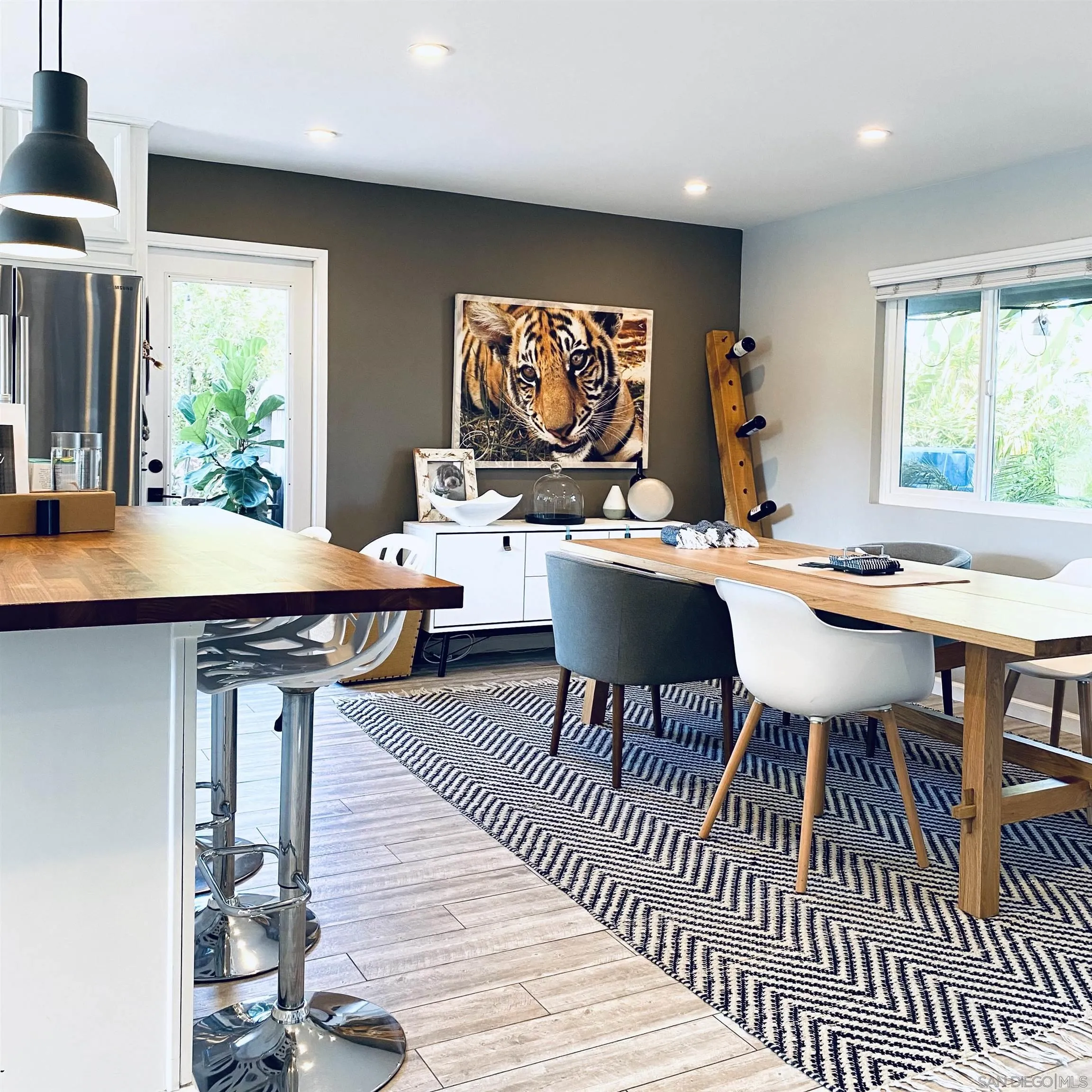 5560 Diane Avenue San Diego, CA 92117 - Photo 12 of 31 a view of a dining room with furniture window and wooden floor