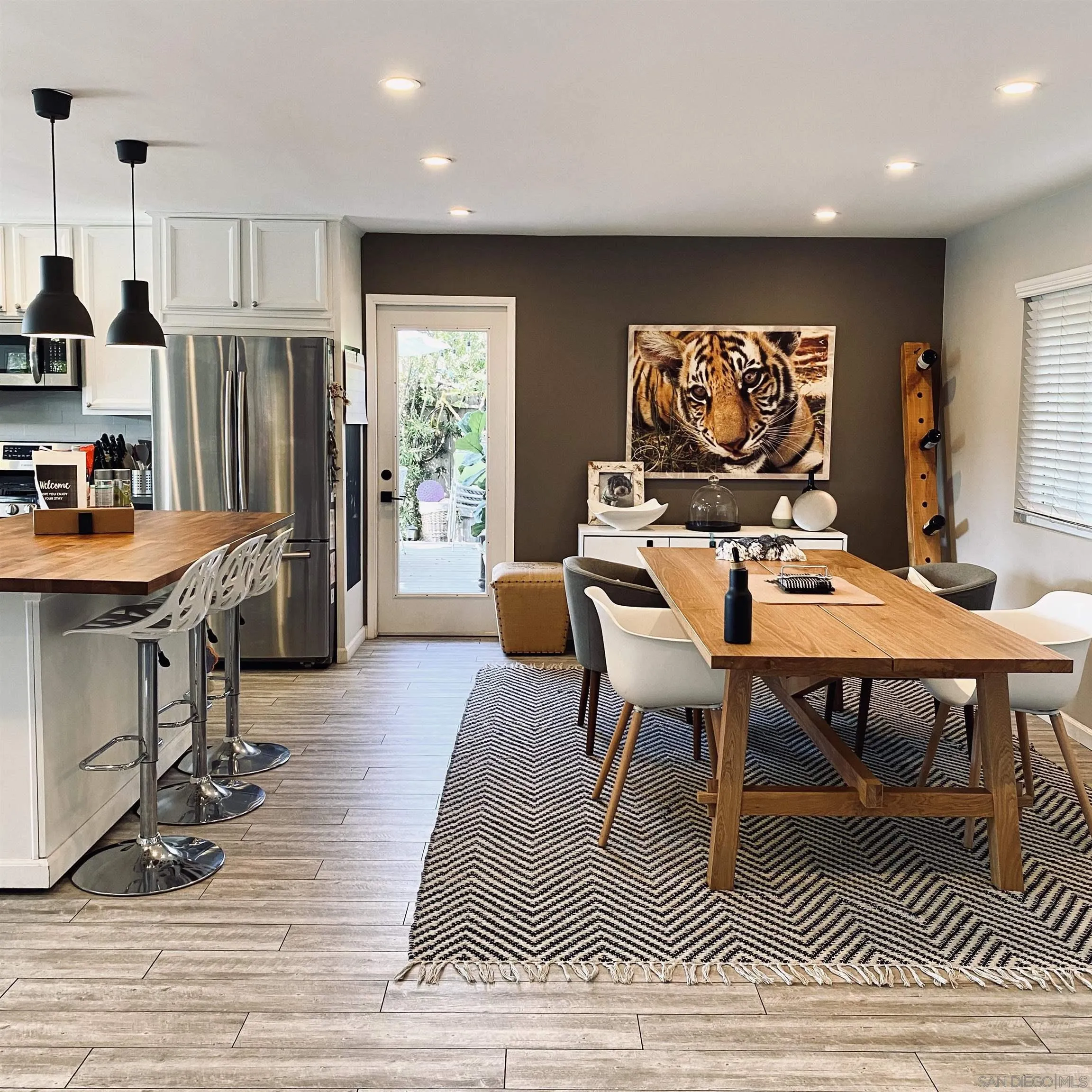 5560 Diane Avenue San Diego, CA 92117 - Photo 13 of 31 a view of a dining room with furniture window and wooden floor