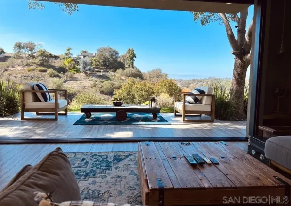 a view of a living room and kitchen