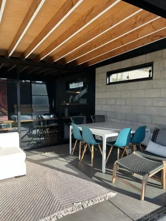 a patio with table and chairs