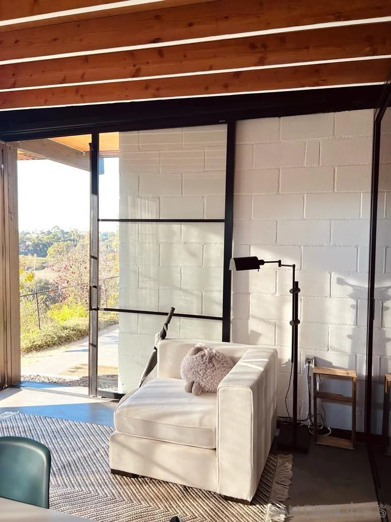 5560 Diane Avenue San Diego, CA 92117 - Photo 24 of 31 a bedroom with a bed and a large window