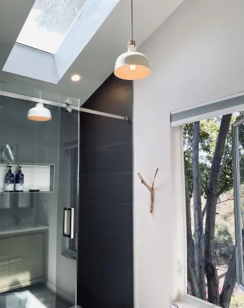 a room with lots of counter space and a chandelier