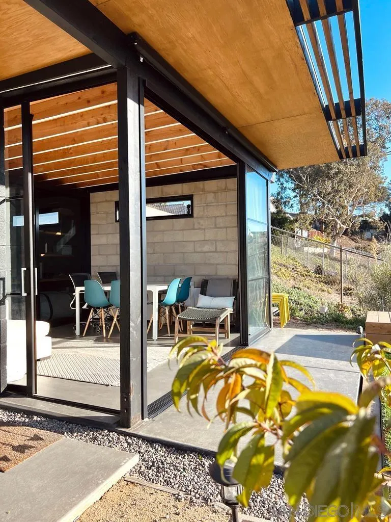 5560 Diane Avenue San Diego, CA 92117 - Photo 6 of 31 a view of a patio with a table and chairs and potted plants