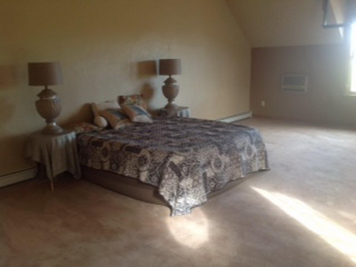2012 J J 1/2 Road Fruita, CO 81521 - Photo 15 of 36 a bedroom with a bed and a night stand