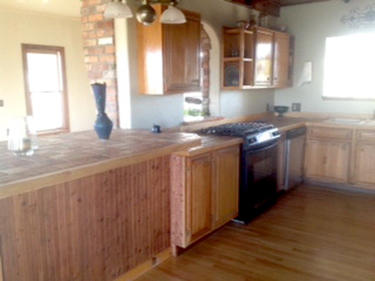 2012 J J 1/2 Road Fruita, CO 81521 - Photo 4 of 36 a kitchen with a sink stove and cabinets