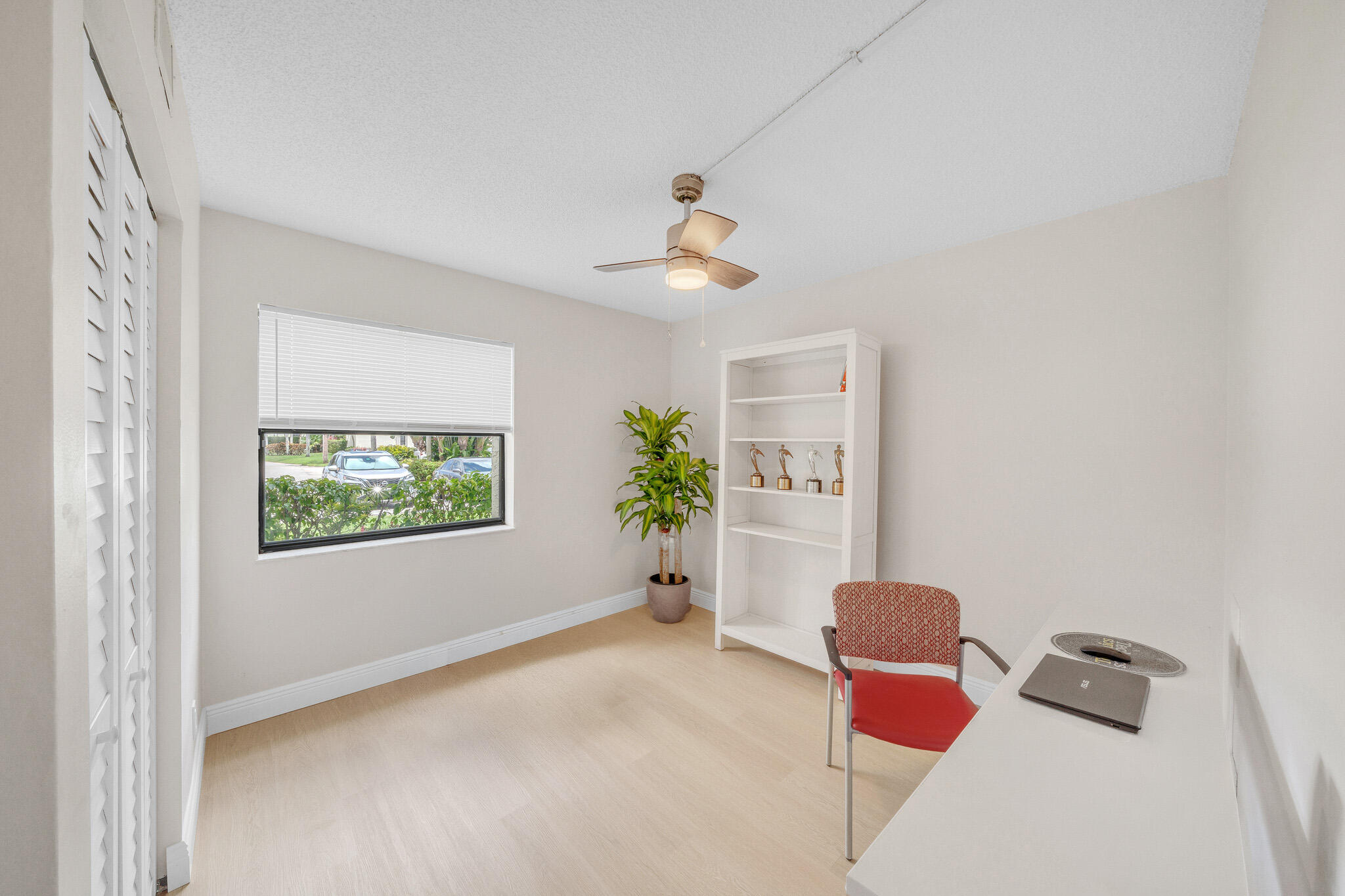 22136 Palms Way, Unit 103 Boca Raton, FL 33433 - Photo 32 of 42 a bedroom with furniture and a window