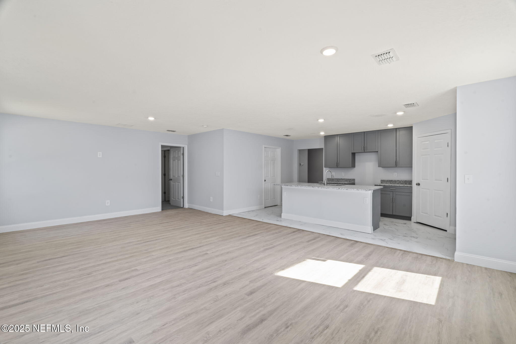 9332 Sisson Drive Jacksonville, FL 32218 - Photo 18 of 42 a view of a kitchen with wooden floor and a sink