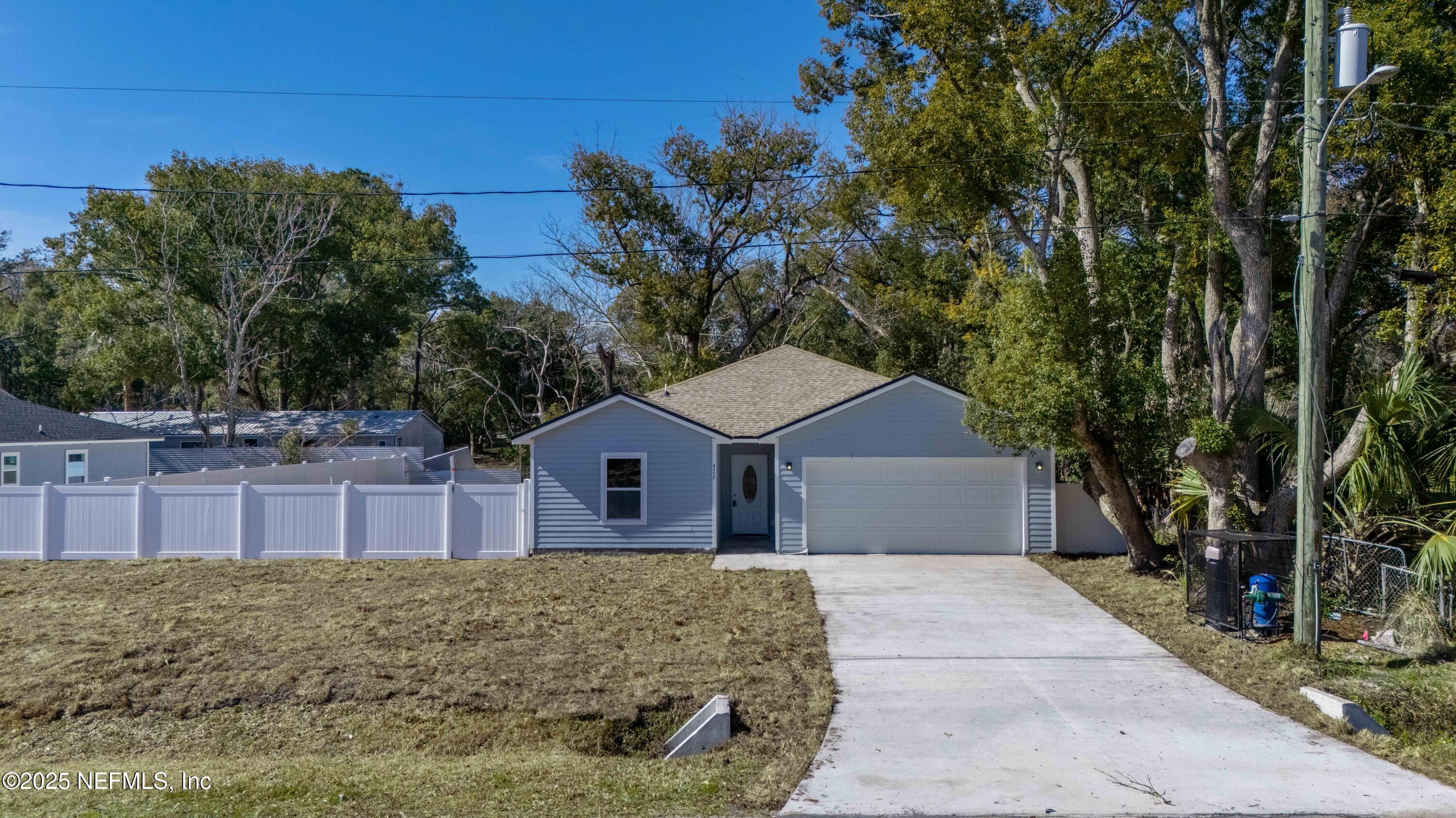 9332 Sisson Drive Jacksonville, FL 32218 - Photo 2 of 42 a view of a house with a yard and large tree