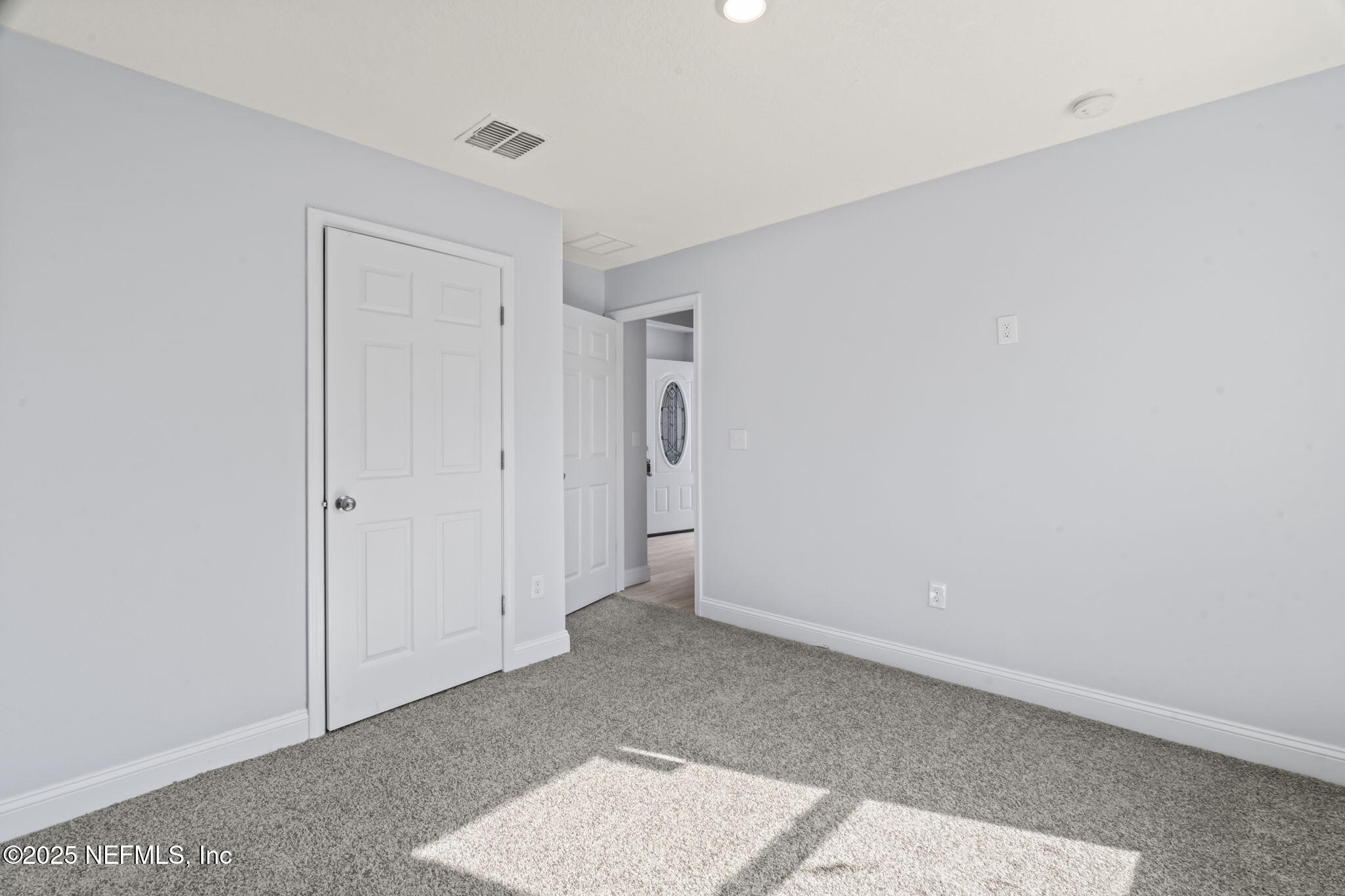 9332 Sisson Drive Jacksonville, FL 32218 - Photo 9 of 42 an empty room with closet