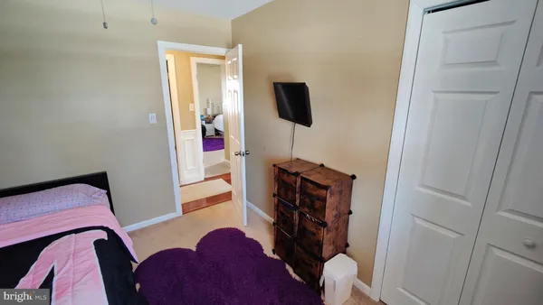 a view of a livingroom with furniture and a window