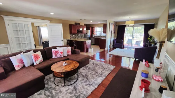 a living room with furniture fireplace and a table