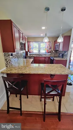 a room with dining table and chairs