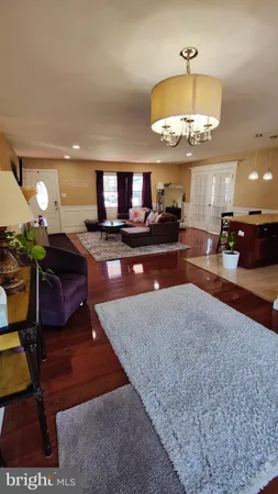 a large kitchen with a table and a large window
