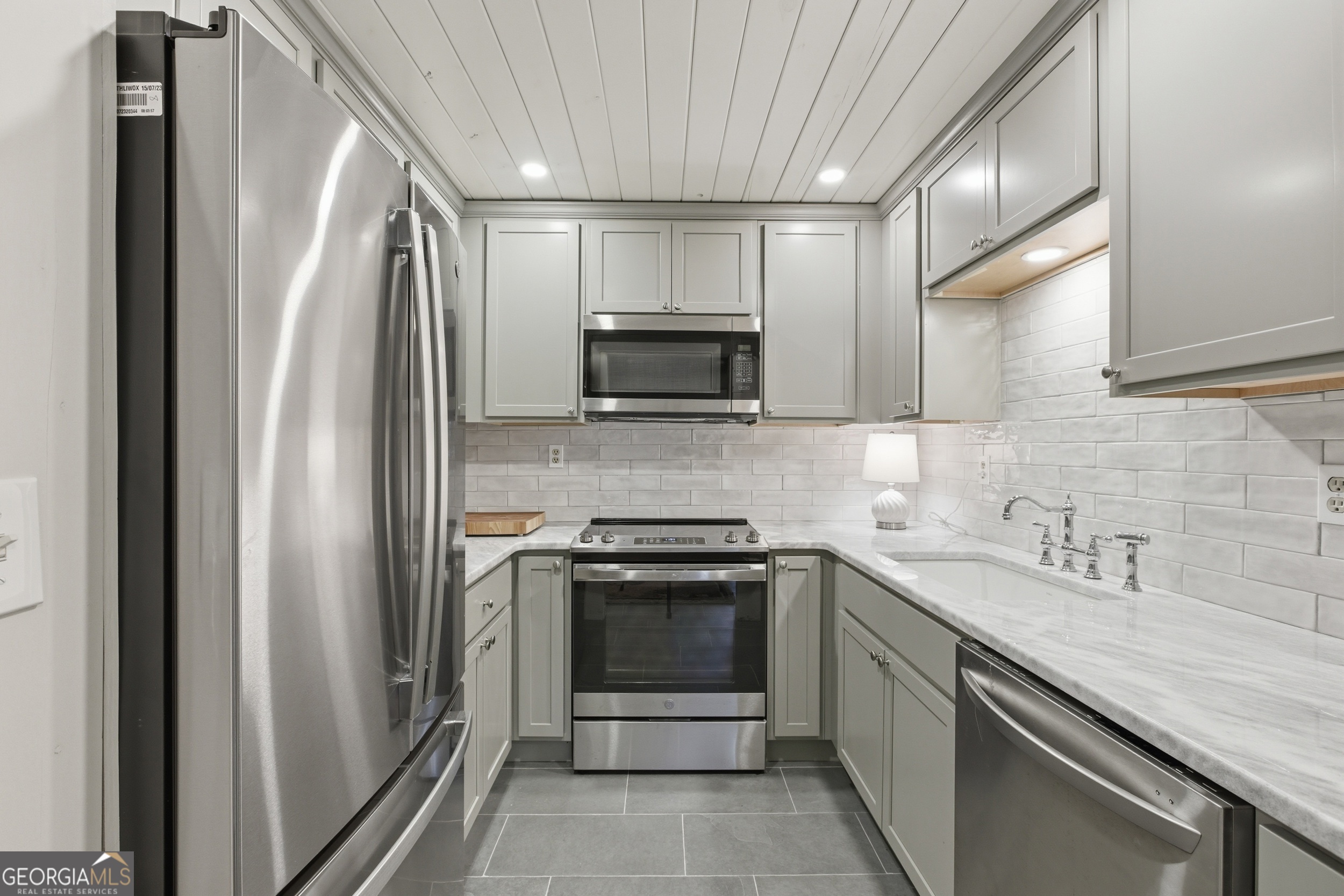 1921 Franklin Road Highlands, NC 28741 - Photo 31 of 72 a kitchen with stainless steel appliances granite countertop a refrigerator and a sink