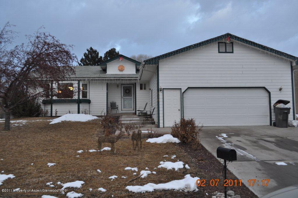 918 Edelweiss Court Rifle, CO 81650 - Photo 1 of 9 a front view of a house with a yard