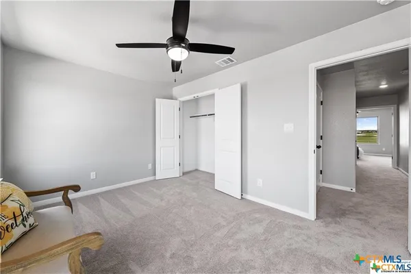 a view of livingroom with hardwood floor and ceiling fan