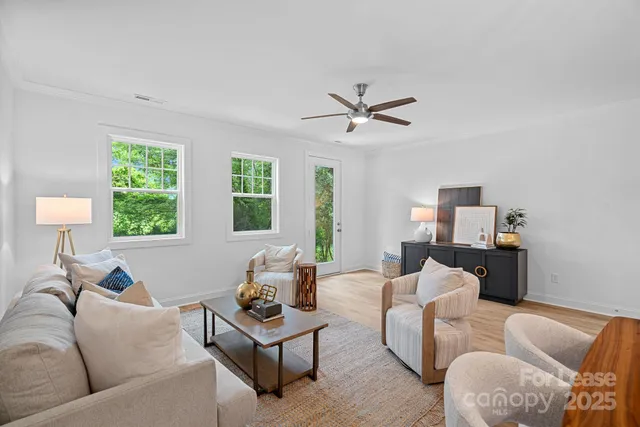 a living room with furniture and a window