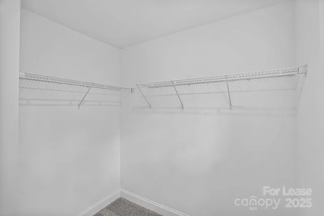 a view of a room with racks on the wall