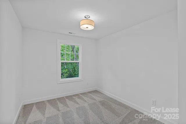 a view of a window in an empty room