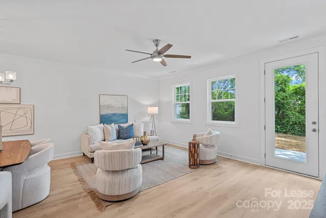 a living room with furniture and a window