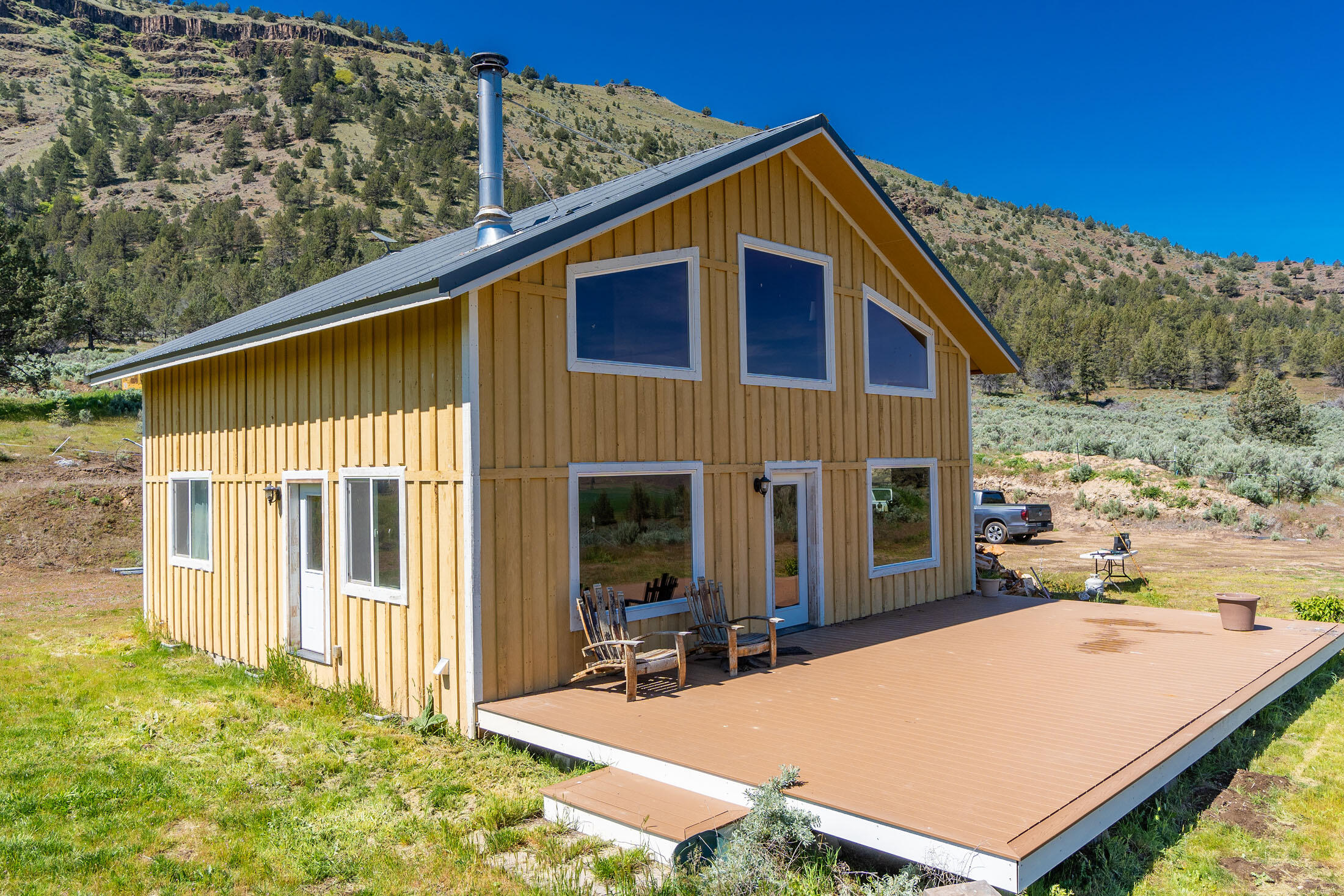 40252 Rudio Road Kimberly, OR 97848 - Photo 17 of 34 a view of house with backyard porch and furniture